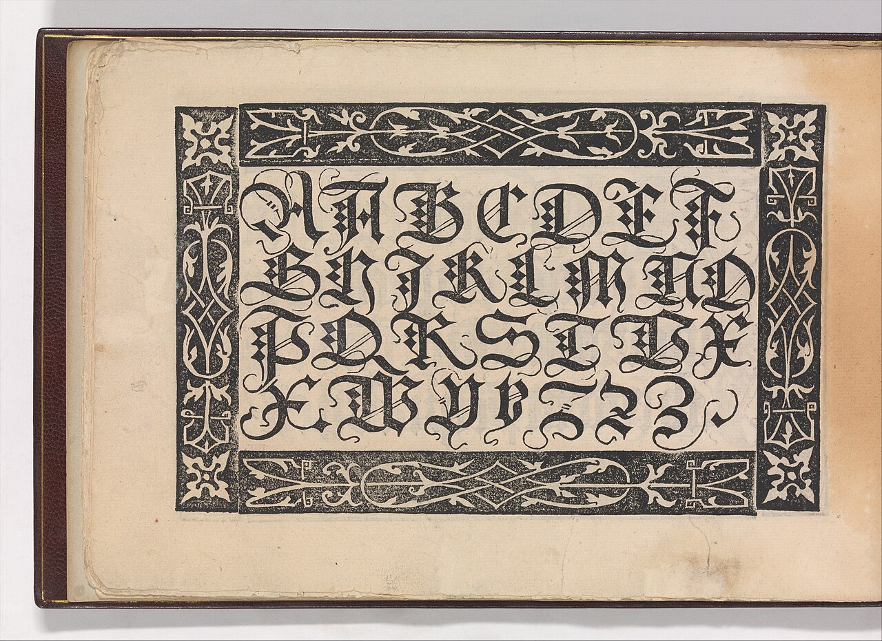 open book writing (foto: Creator:Urban Wyss / CC0, Wikimedia Commons)
